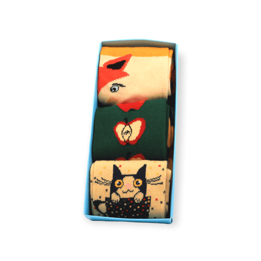 The full cotton socks box set with apple fox and cat in a cup designs laid flat