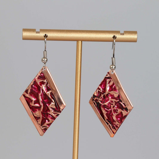Close-up of the copper texture on handcrafted pink wrinkled copper earrings