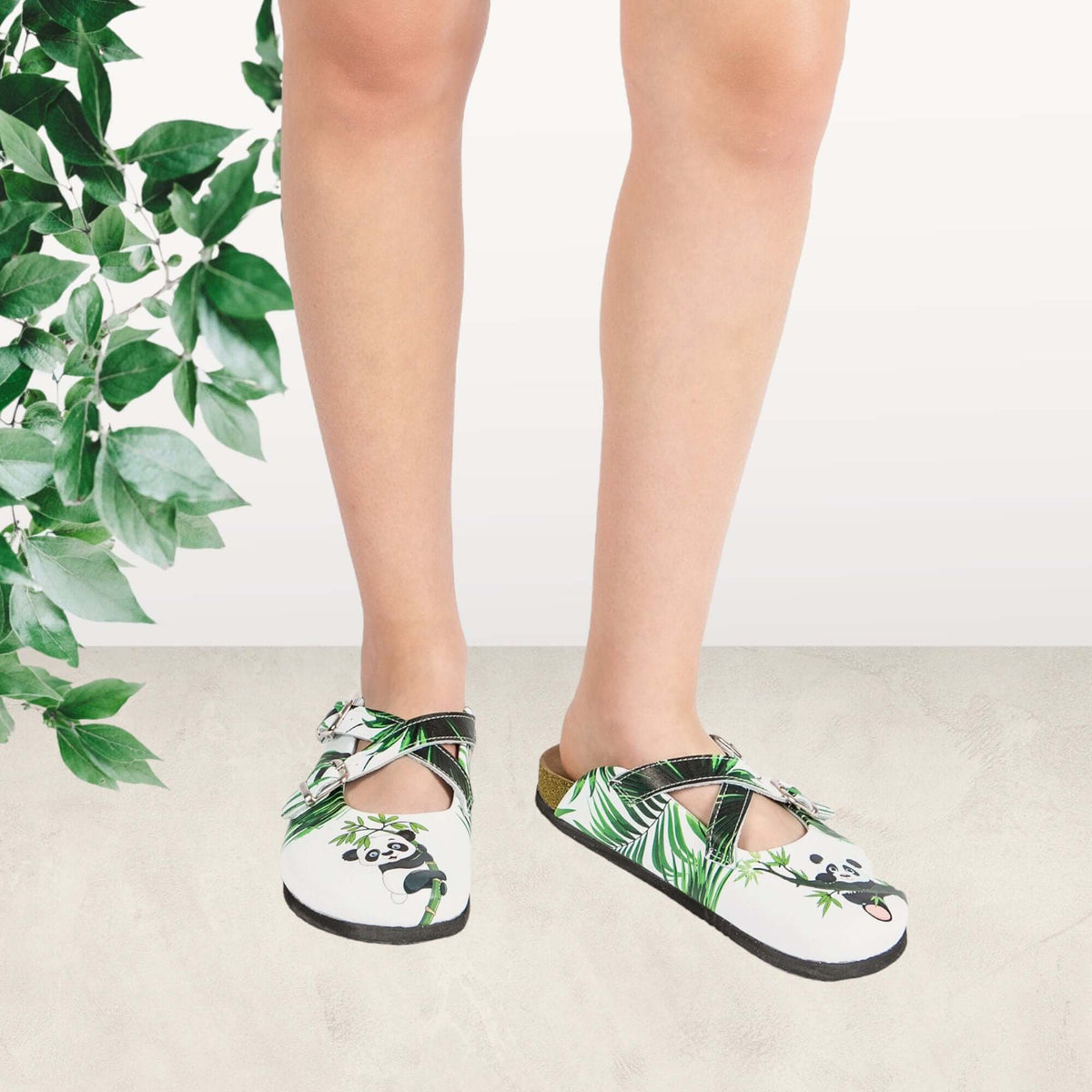 Pair of panda tree leather cork sole clogs side by side