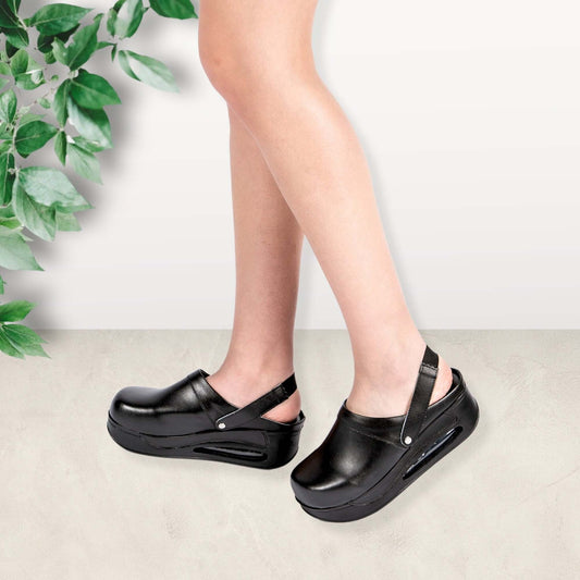 Side profile of black leather back strap clogs with an Air Clogx sole