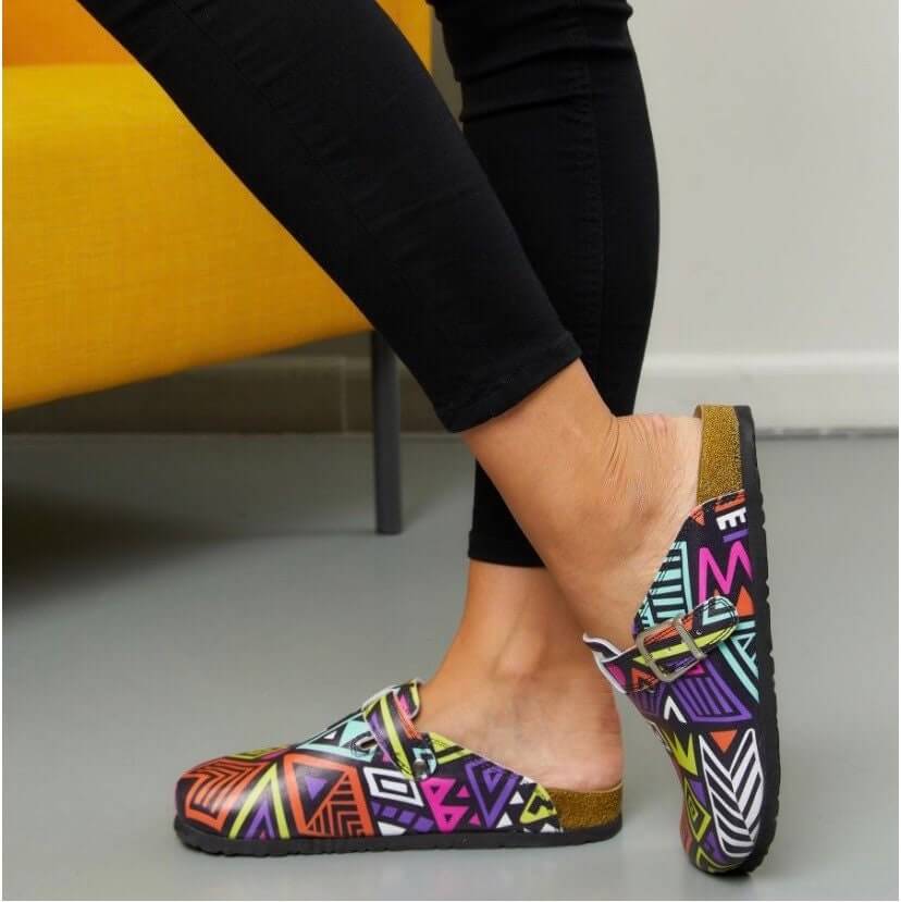 Top-down view of colourful handmade leather cork sole clogs
