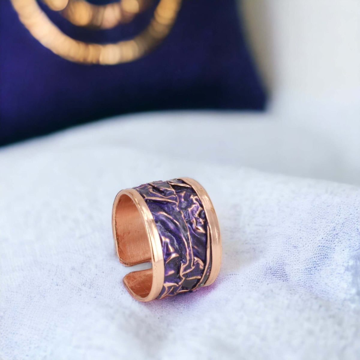 Inside band view of purple wrinkled copper adjustable ring
