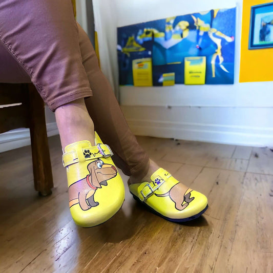 Sausage dog leather cork sole clogs seen in side profile