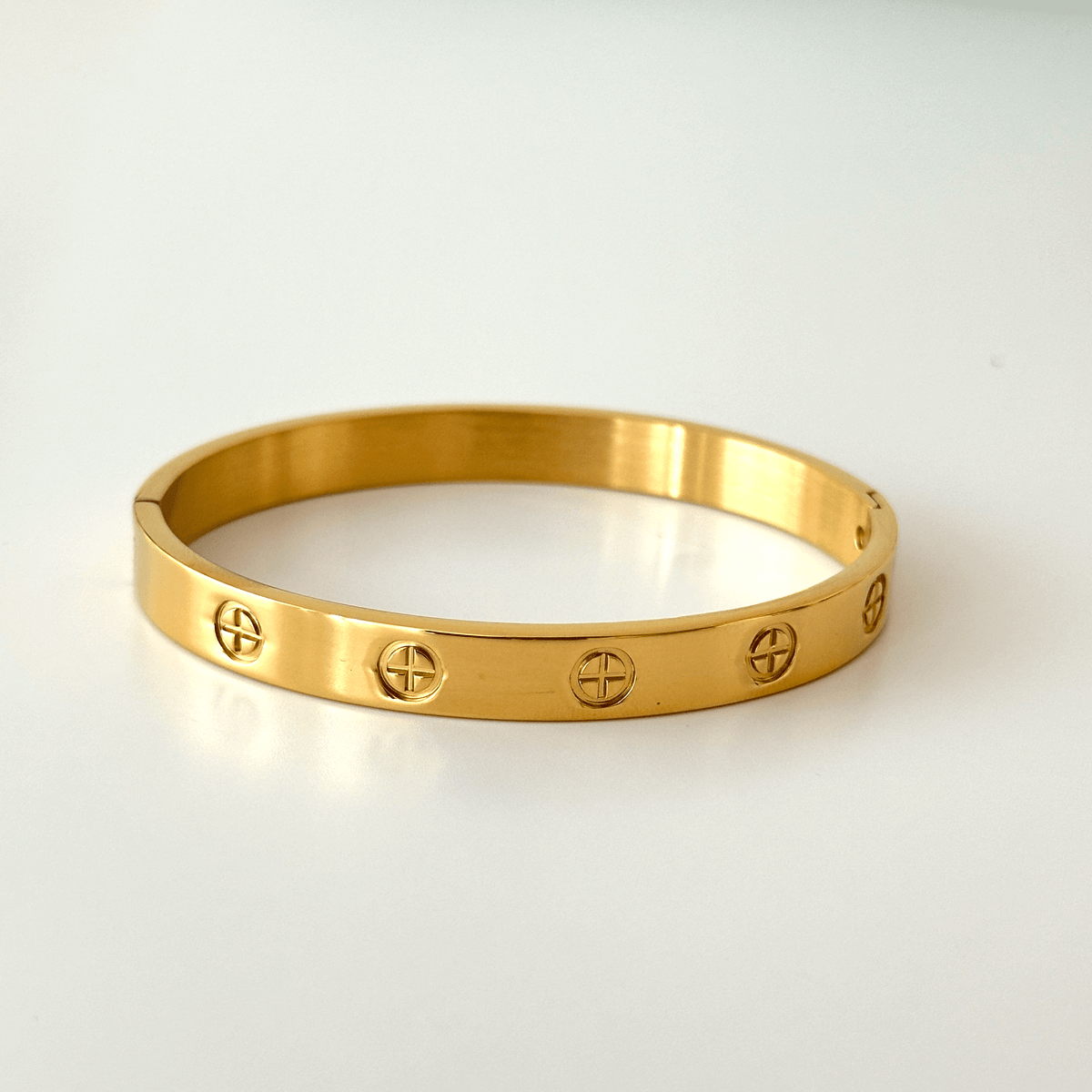 Gold plated stainless steel couple bangle worn on the wrist