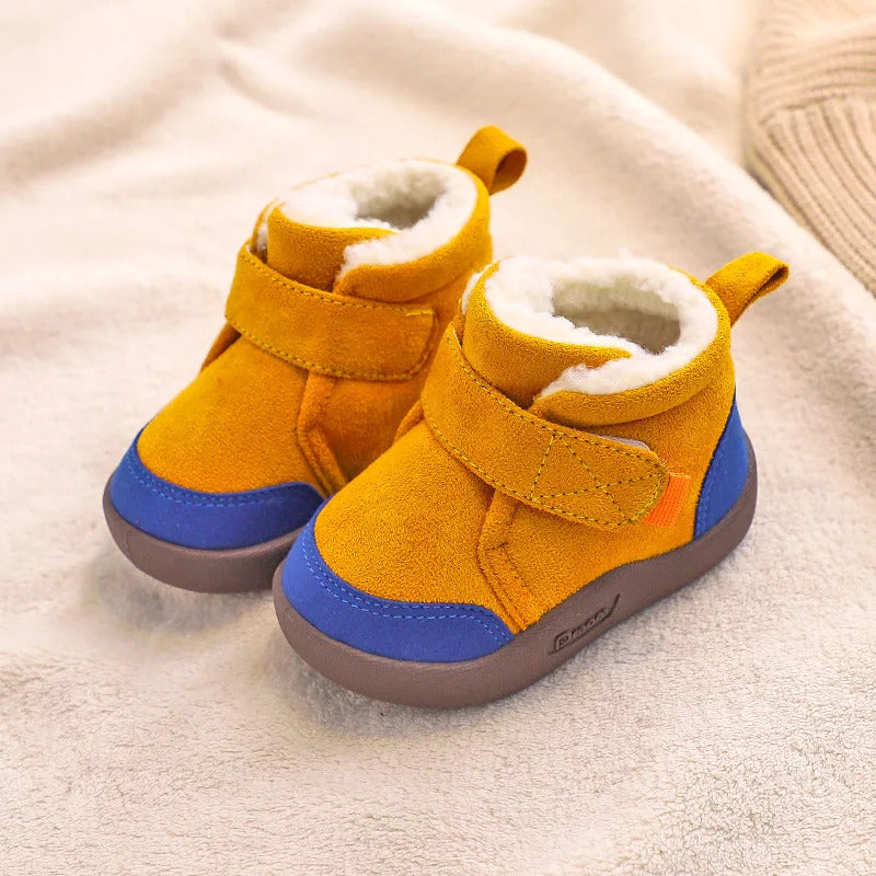 Warm unisex winter baby boots with a non-slip first walker sole worn on the foot