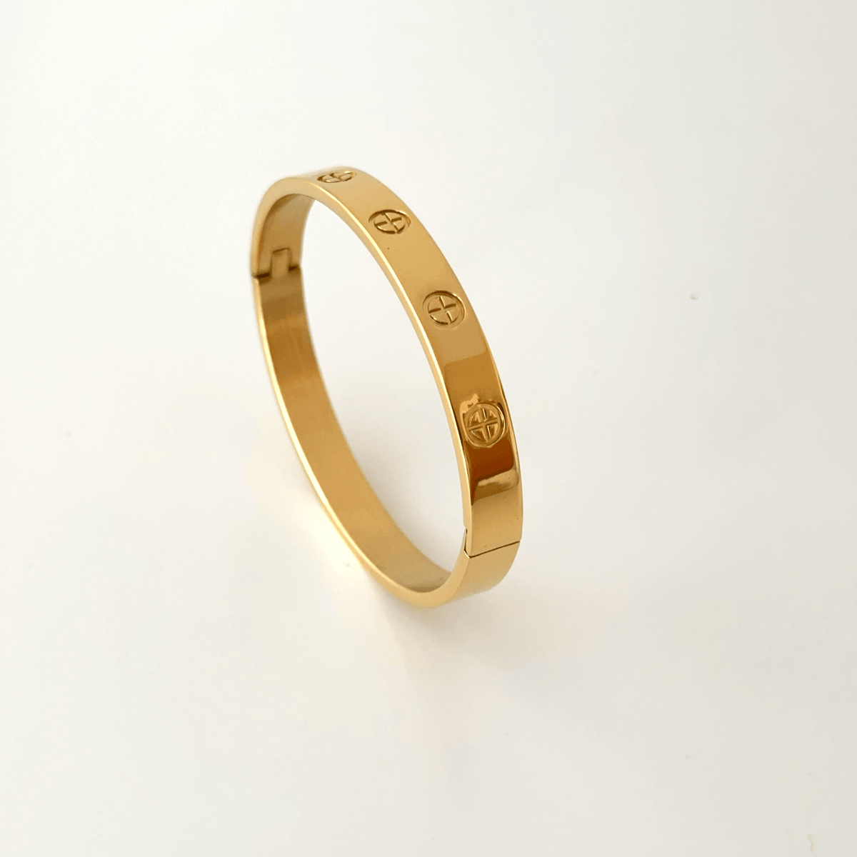 Top-down view of gold plated stainless steel couple bangle