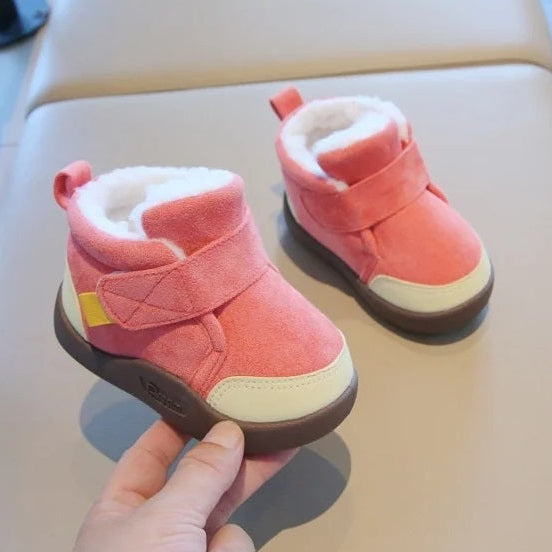 Warm unisex winter baby boots with a non-slip first walker sole shown on a model