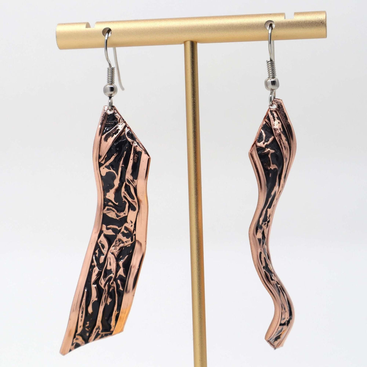 Side angle of handcrafted black wrinkled copper jewellery set