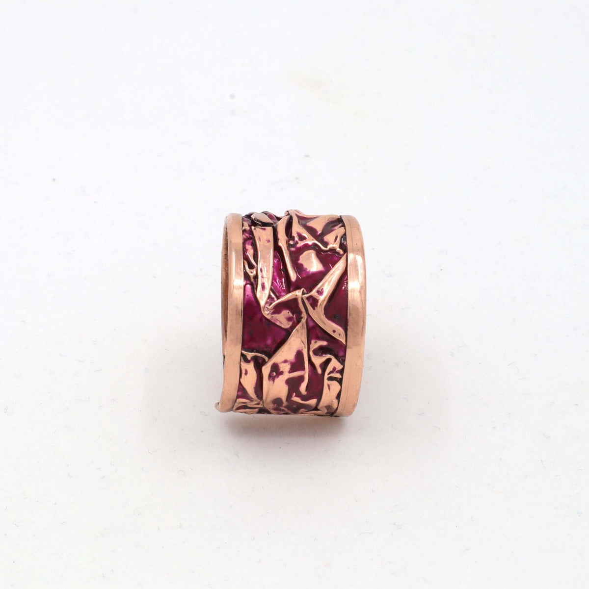 Close-up of the adjustable open band on handmade magenta wrinkled copper adjustable ring