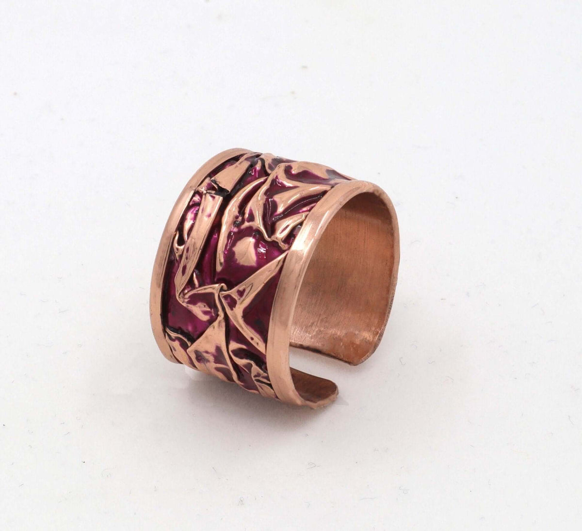 Side angle of handmade magenta wrinkled copper adjustable ring