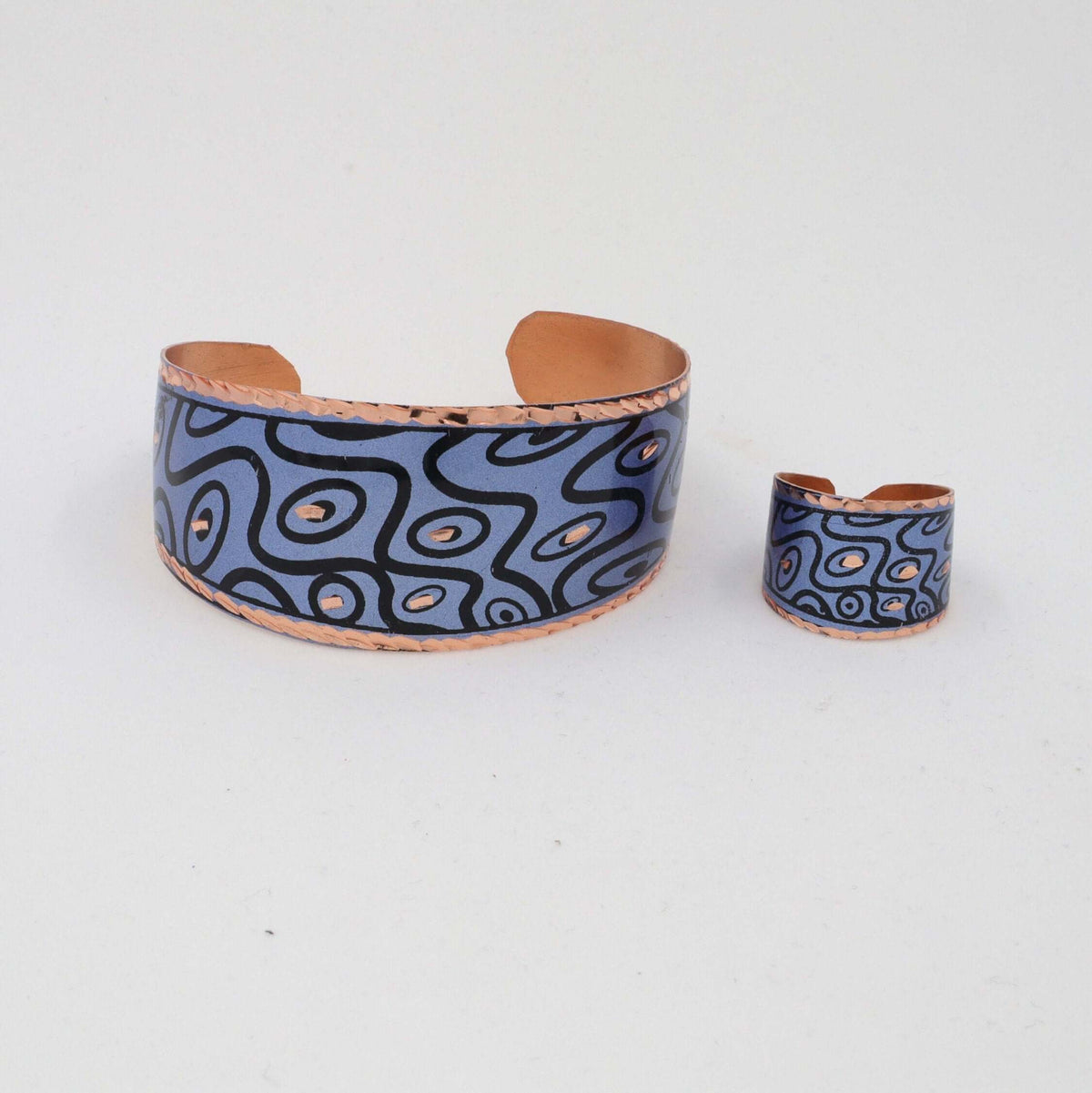 Close-up of one piece from handcrafted blue curvy copper statement jewellery set