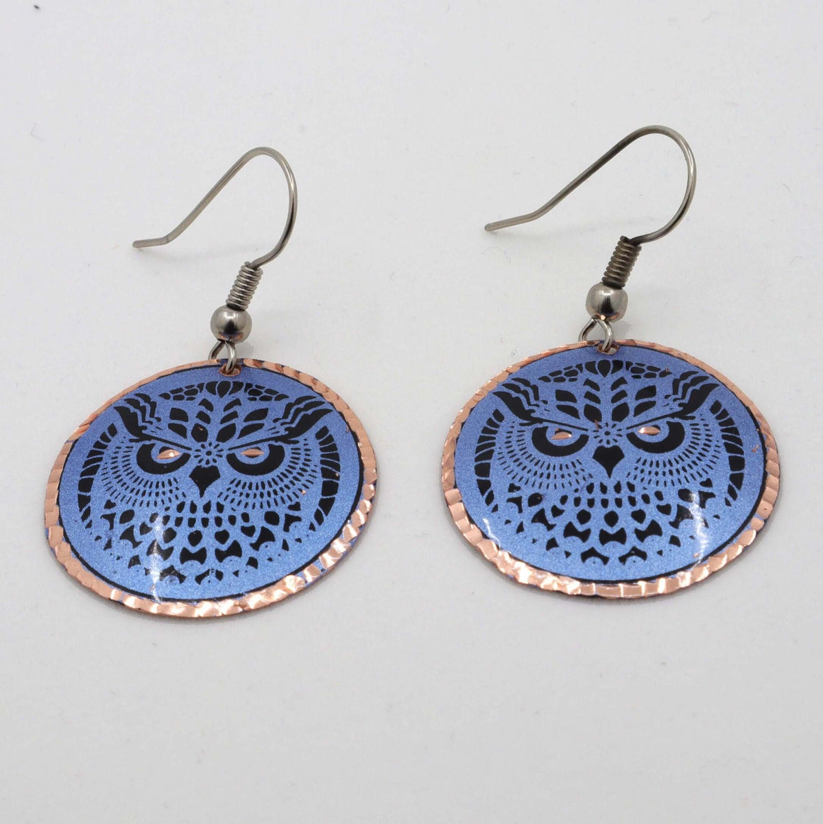Back view of handcrafted blue owl copper circle earrings