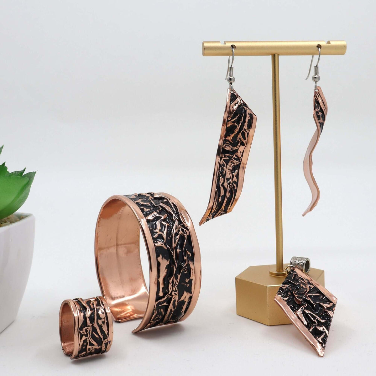 Close-up of the copper texture in handcrafted black wrinkled copper jewellery set