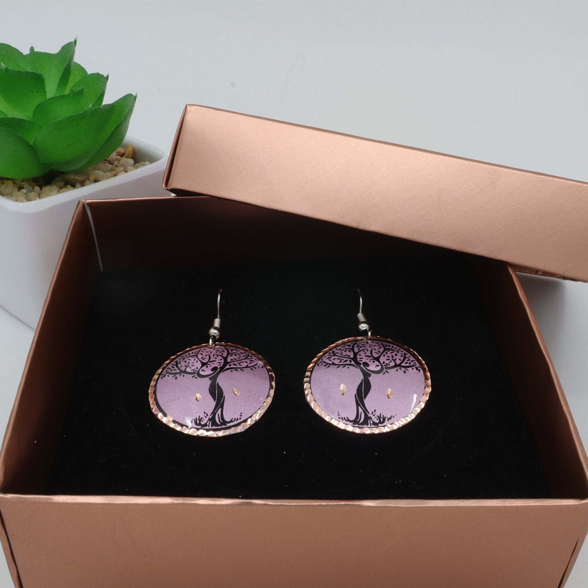 Side angle of handcrafted lavender tree copper circle earrings
