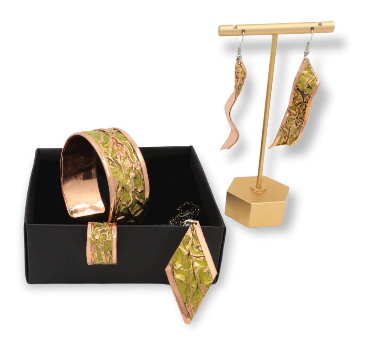 Close-up of one piece from four-piece yellow wrinkled copper jewellery set
