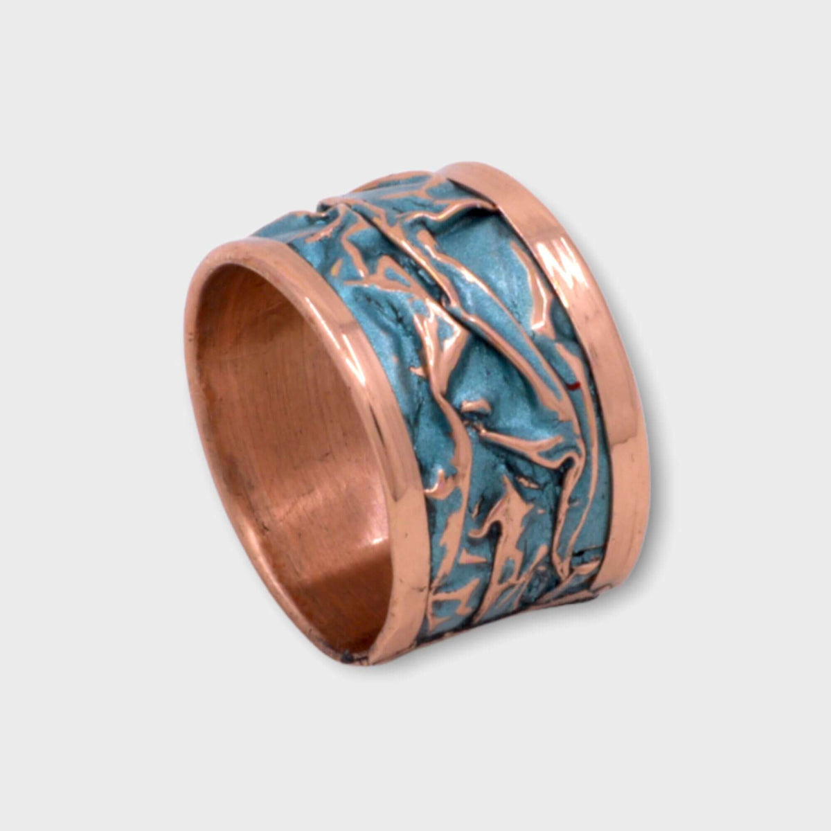 Top-down view of turquoise wrinkled copper adjustable ring