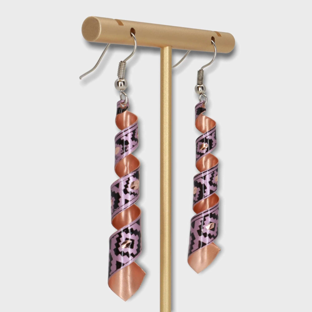 Side angle of handcrafted artisan pink auger copper earrings