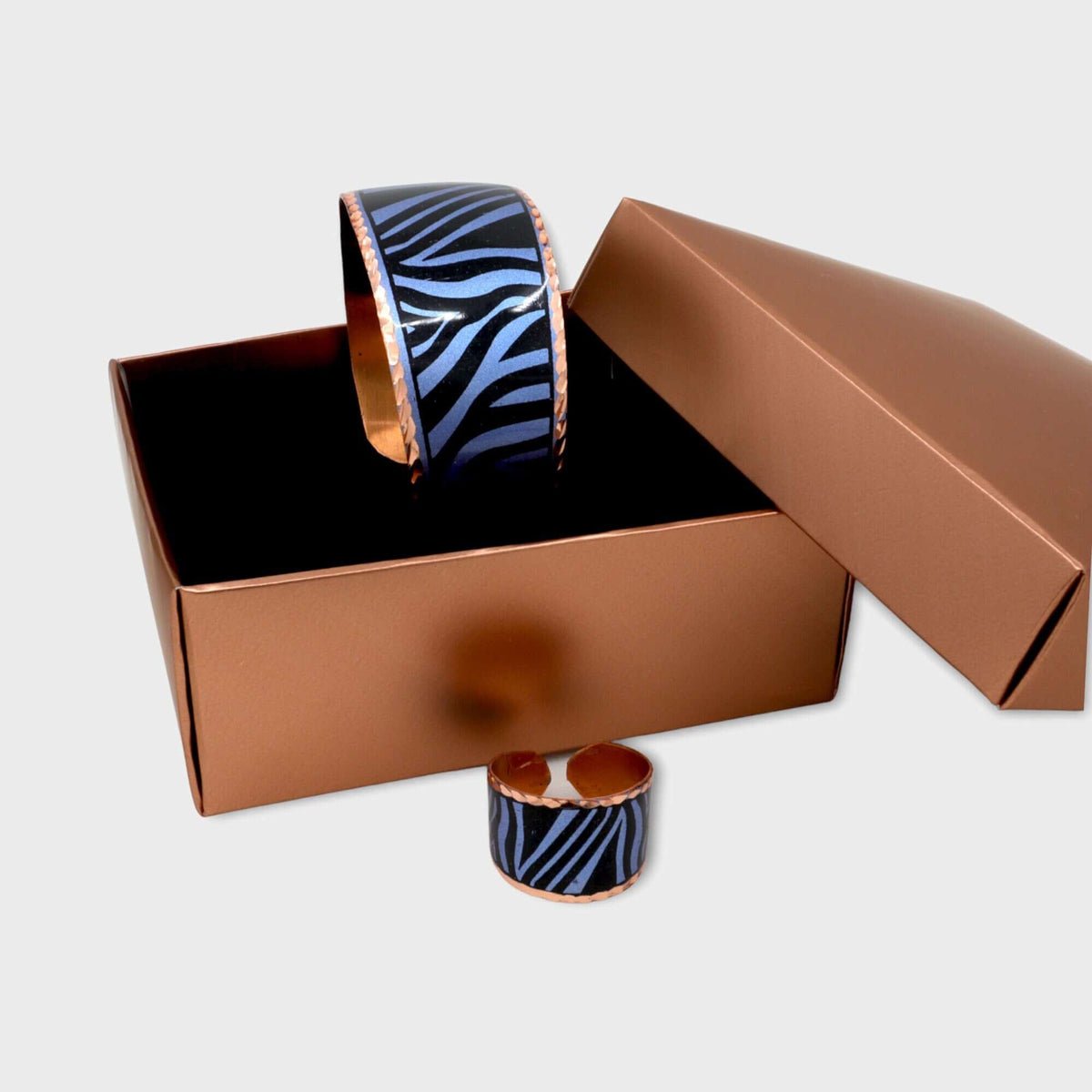 Ring from the adjustable blue copper ring and bracelet jewellery set worn on the finger