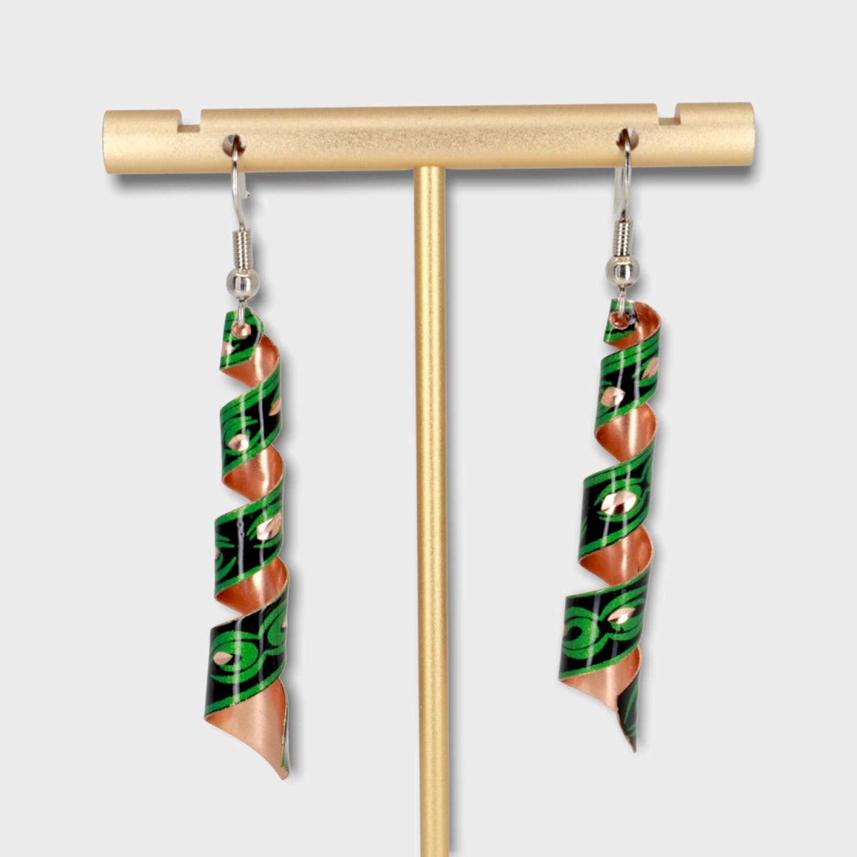 Handcrafted artisan green auger copper earrings worn on the ear