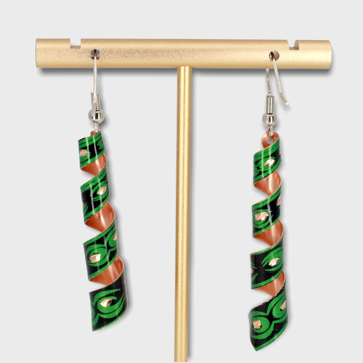 Handcrafted artisan green auger copper earrings displayed on a plain background