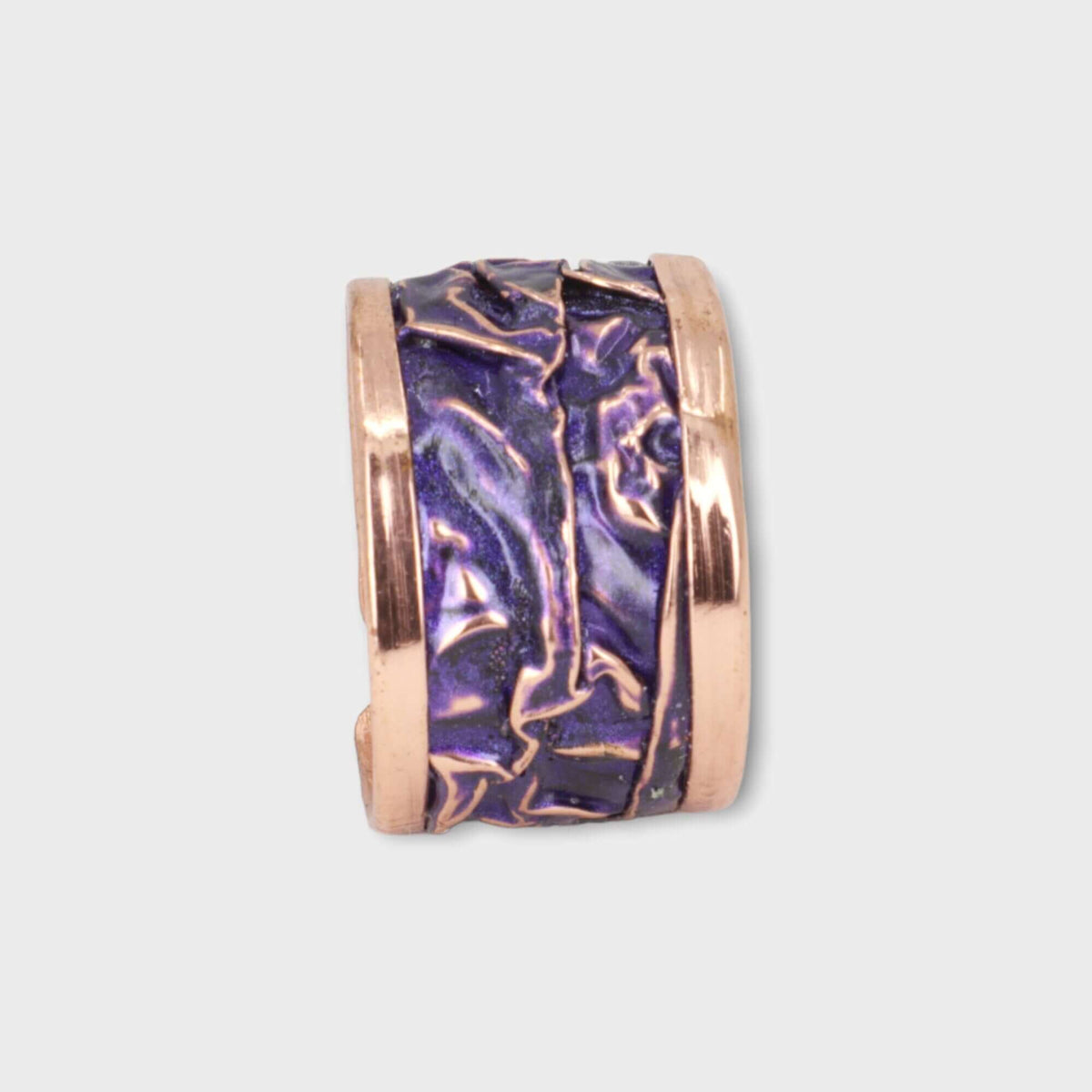 Close-up of the adjustable open band on purple wrinkled copper adjustable ring