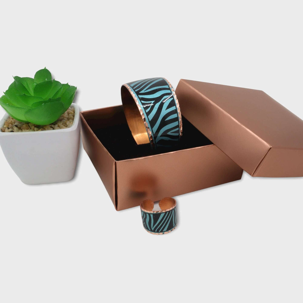 Ring from the adjustable turquoise copper ring and bracelet set worn on the finger