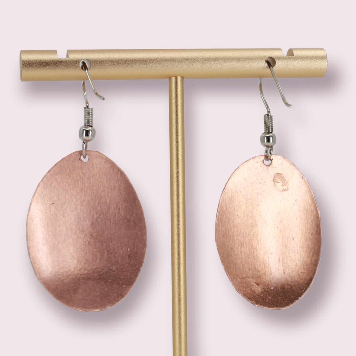 Artisan Queen Elizabeth II copper oval earrings displayed on a plain background