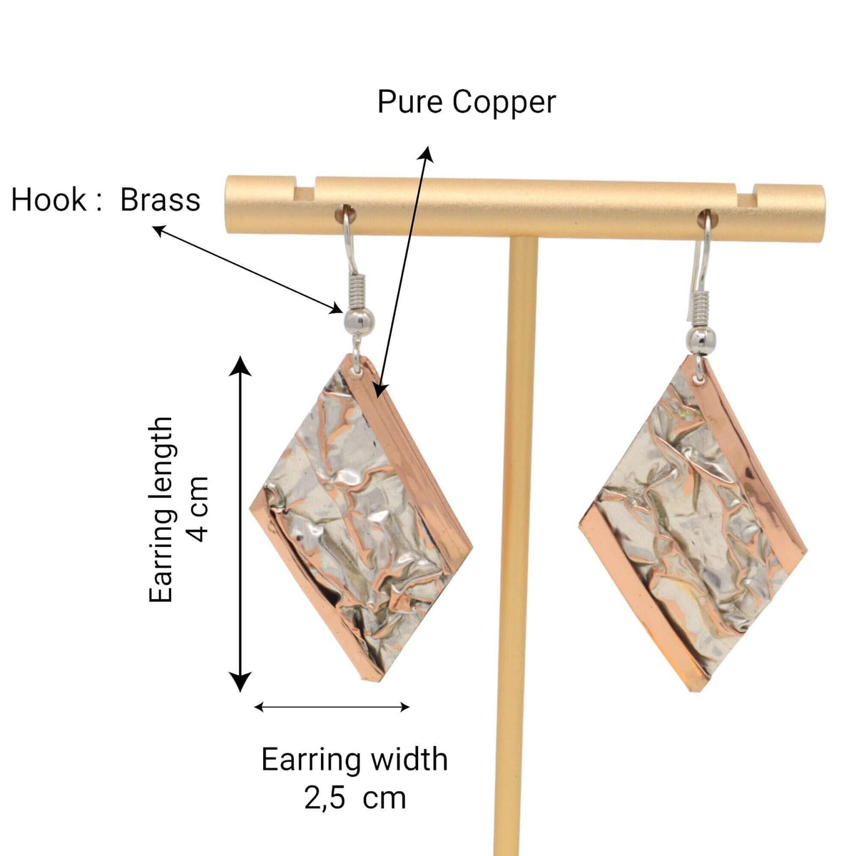 Top-down view of handcrafted wrinkled copper jewellery set