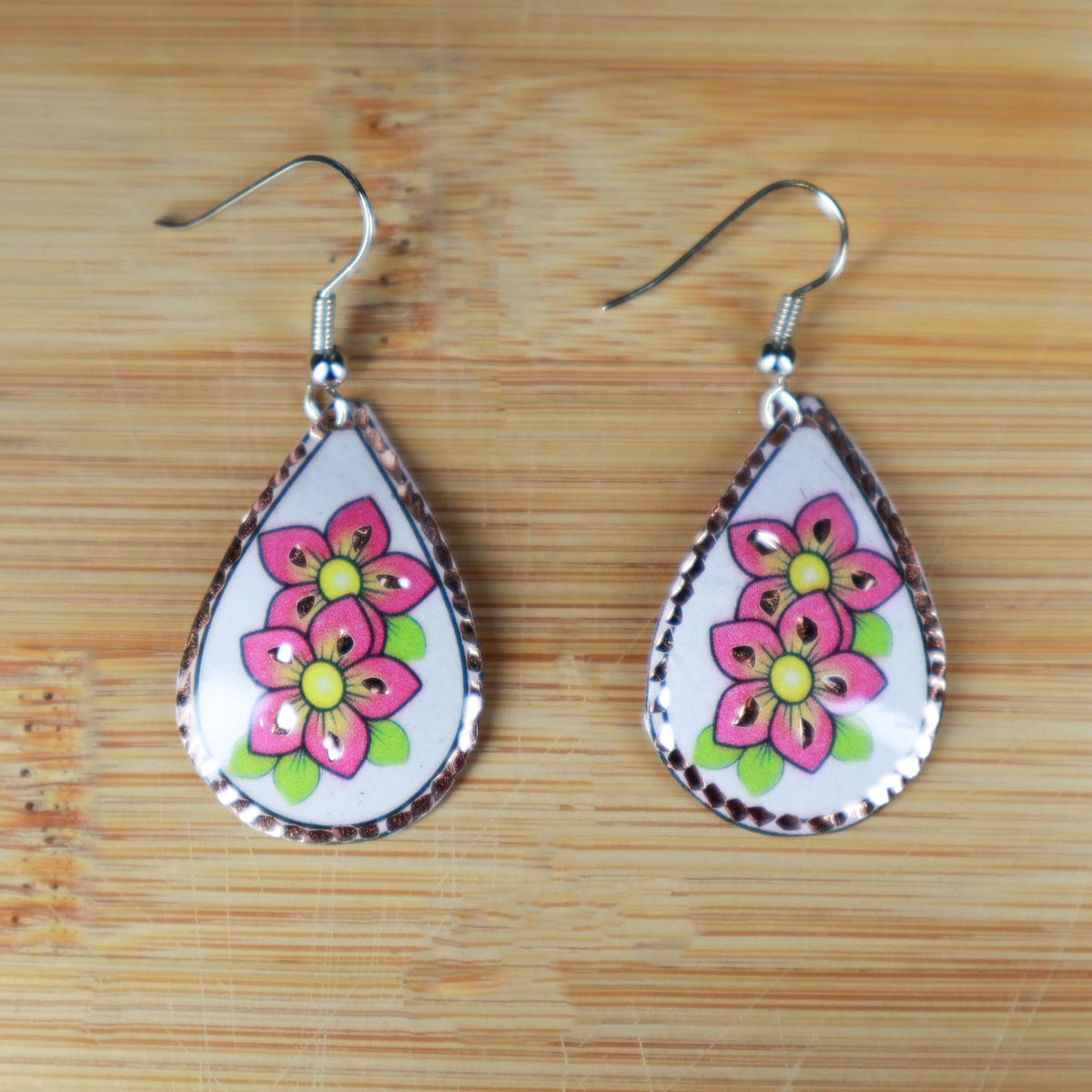 Back view of handcrafted pink flower copper drop earrings